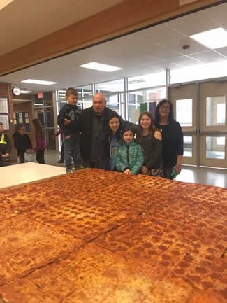  Steve Mallie, owner of Mallie's Sports Grill and Bar has become the talk of the town for making the biggest pizza of the world, measuring 72 inches. Last year he made the headlines for making a 1,796 pound hamburger.