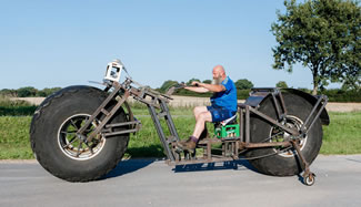 Frank Dose constructed world's heaviest rideable bicycle from scrap steel, and fitted it with giant, 5-foot diameter tires that once belonged to an industrial fertilizer spreader.